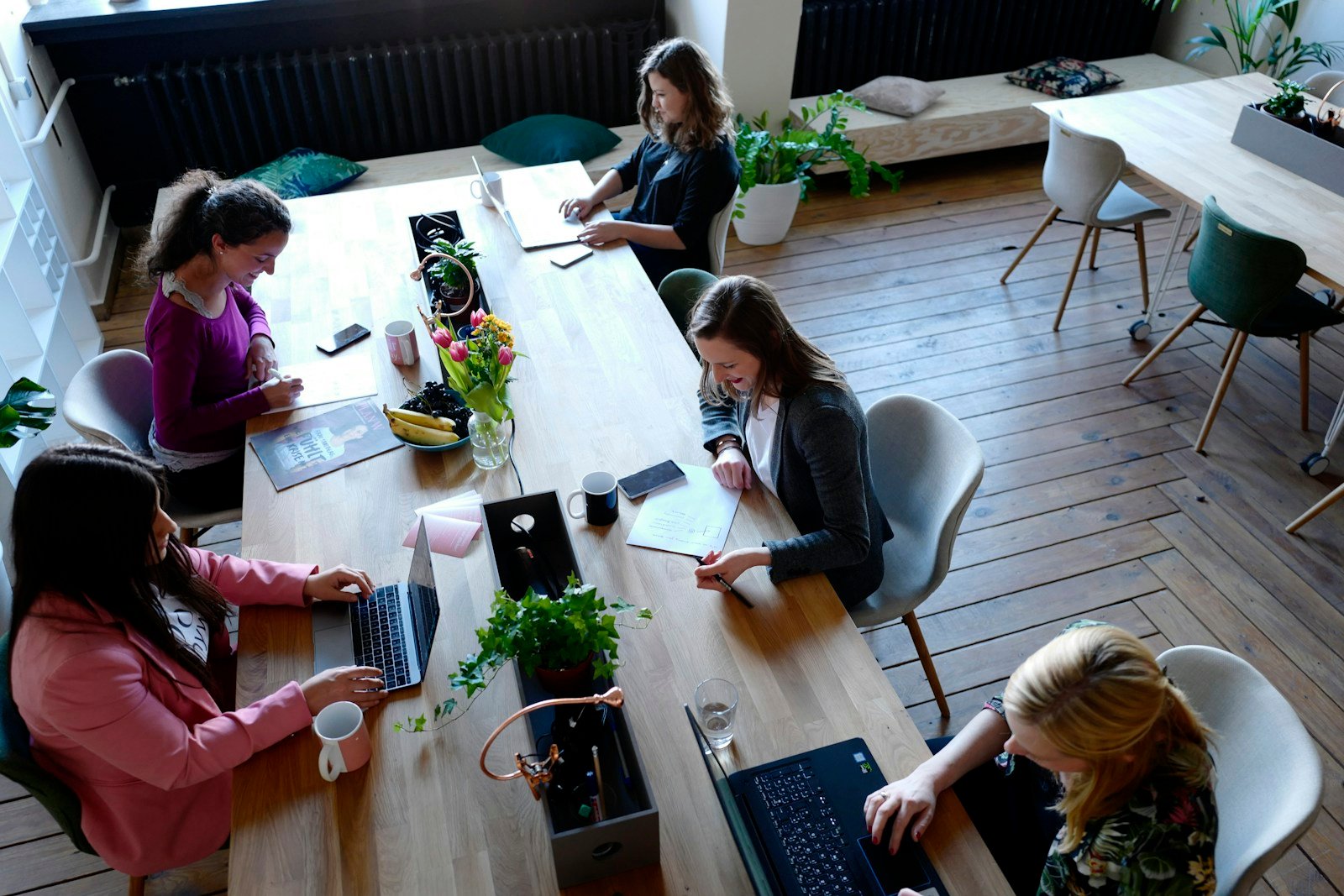 Creative professionals collaborating around a table