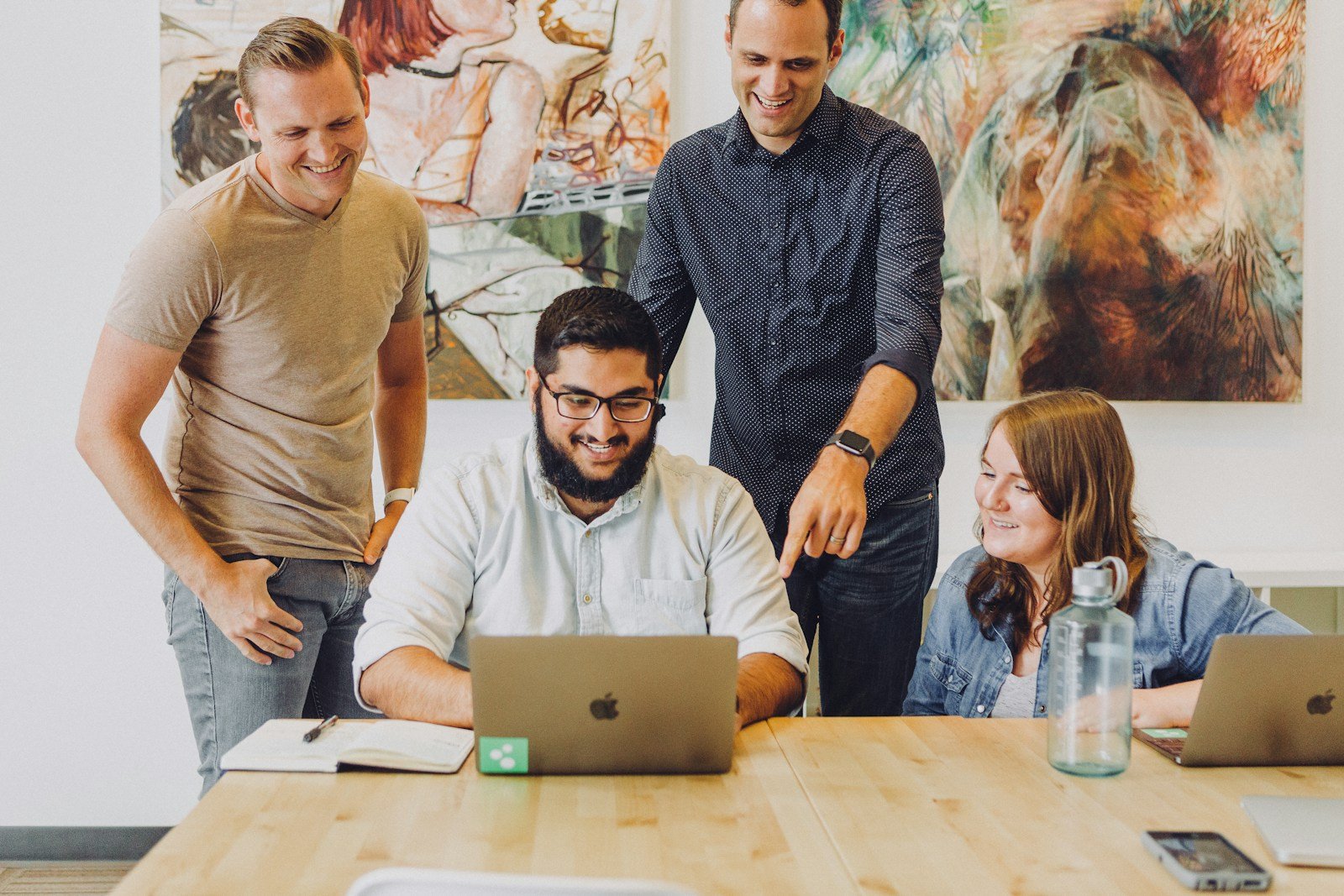 Creative team reviewing design work together